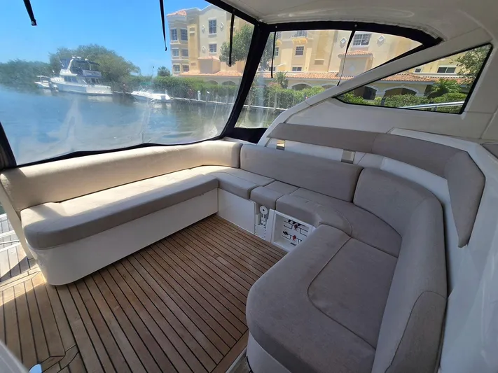  Yacht Photos Pics 2013 Fairline Targa 38 Open yacht interior with cushioned seating and wooden flooring.