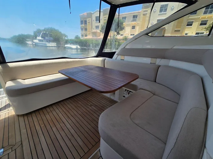  Yacht Photos Pics 2013 Fairline Targa 38 Open yacht interior with seating and wooden table.