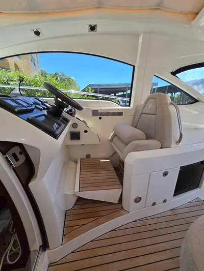  Yacht Photos Pics 2013 Fairline Targa 38 Open cockpit with modern controls and comfortable seating.