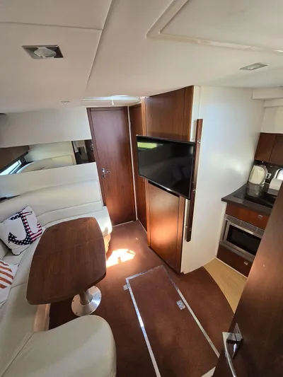  Yacht Photos Pics Interior of 2013 Fairline Targa 38 Open yacht with modern furnishings and kitchen area.