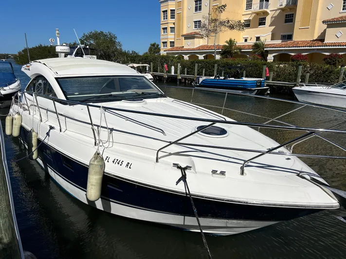  Yacht Photos Pics 2013 Fairline Targa 38 Open yacht docked near waterfront buildings.