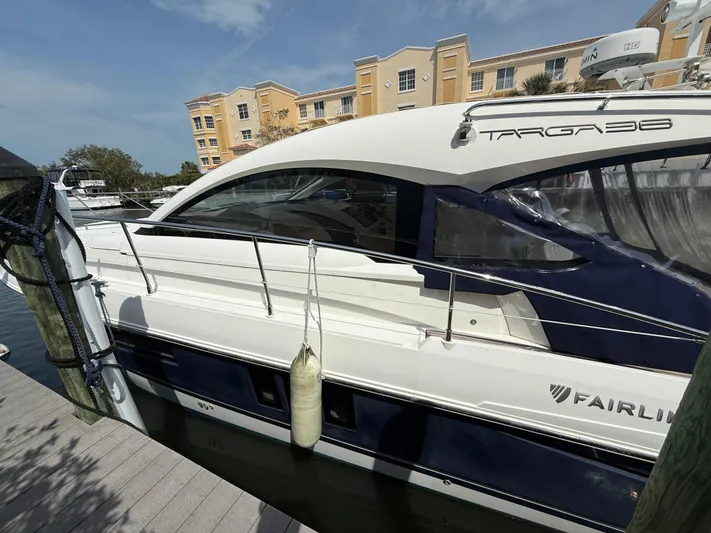  Yacht Photos Pics 2013 Fairline Targa 38 Open yacht docked at marina, side view.