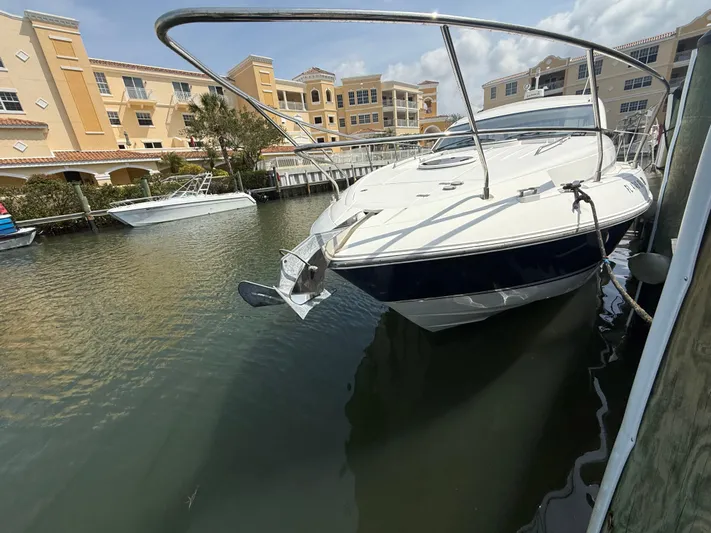  Yacht Photos Pics 2013 Fairline Targa 38 Open yacht docked in a marina, surrounded by buildings.