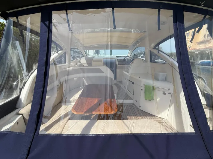  Yacht Photos Pics 2013 Fairline Targa 38 Open yacht interior with seating and table, viewed through clear enclosure.