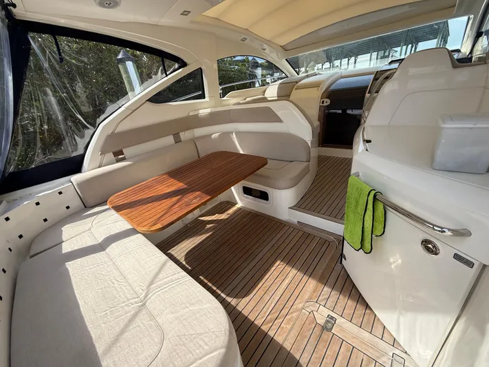  Yacht Photos Pics 2013 Fairline Targa 38 Open interior with wood flooring and seating area.