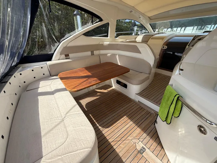  Yacht Photos Pics Interior of 2013 Fairline Targa 38 Open yacht with wooden flooring and seating area.