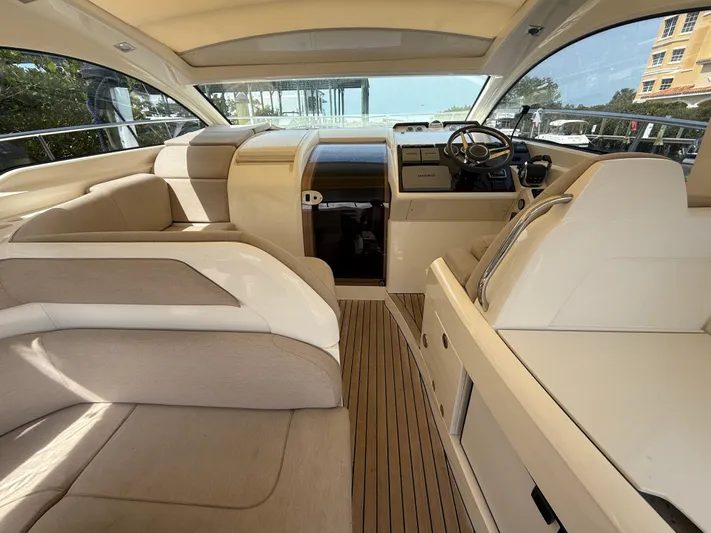  Yacht Photos Pics Interior of 2013 Fairline Targa 38 Open yacht with beige seating and wooden flooring.