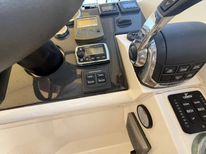  Yacht Photos Pics Control panel of a 2013 Fairline Targa 38 Open yacht with throttle and navigation instruments.