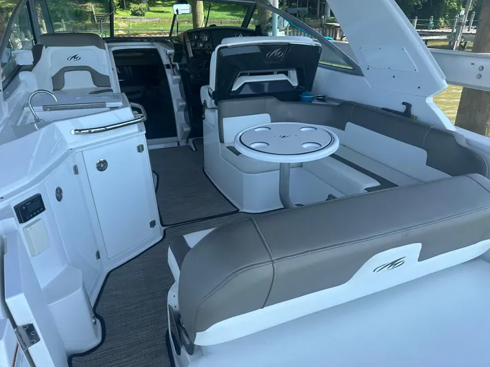 Always Flo&rsquo;n Yacht Photos Pics 2019 Monterey 295 Sport Yacht interior with seating, table, and helm.