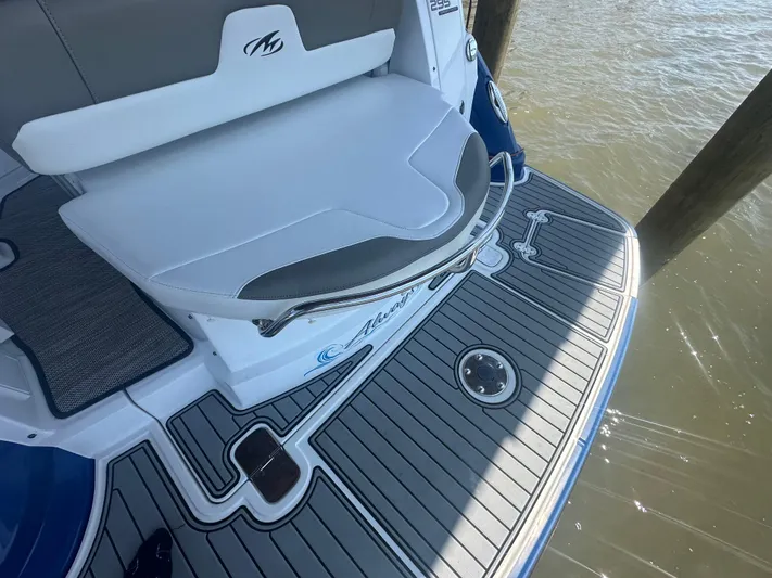 Always Flo&rsquo;n Yacht Photos Pics 2019 Monterey 295 Sport Yacht swim platform with cushioned seating and sleek design.