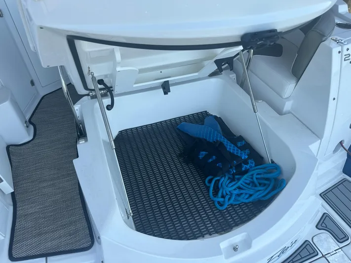 Always Flo&rsquo;n Yacht Photos Pics Open storage compartment on 2019 Monterey 295 Sport Yacht with blue life jackets and rope.