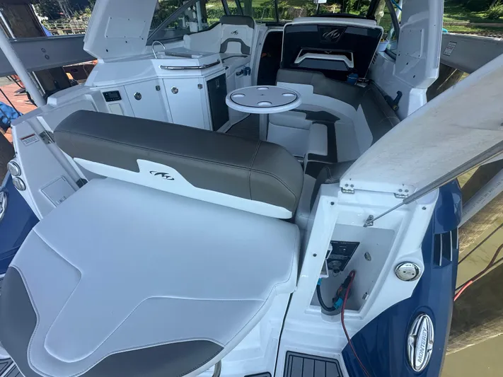 Always Flo&rsquo;n Yacht Photos Pics 2019 Monterey 295 Sport Yacht interior with seating, table, and kitchenette.