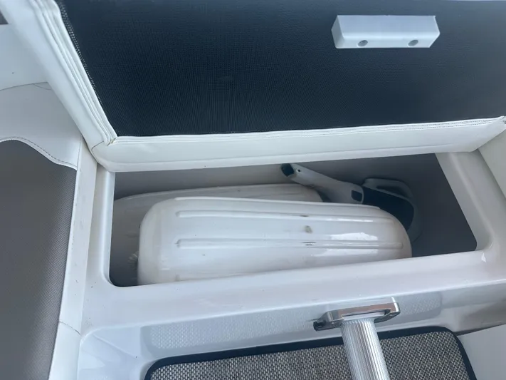 Always Flo&rsquo;n Yacht Photos Pics Storage compartment in 2019 Monterey 295 Sport Yacht, featuring a white fender.