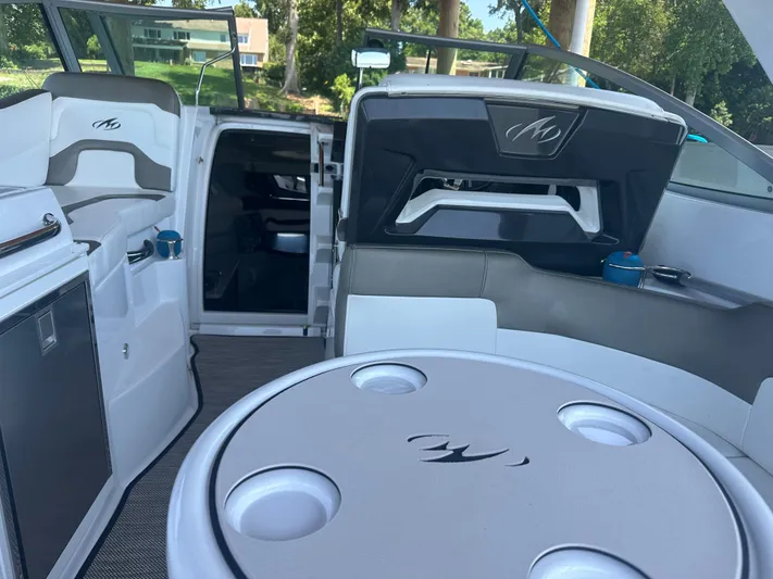 Always Flo&rsquo;n Yacht Photos Pics Interior of a 2019 Monterey 295 Sport Yacht with seating and table.