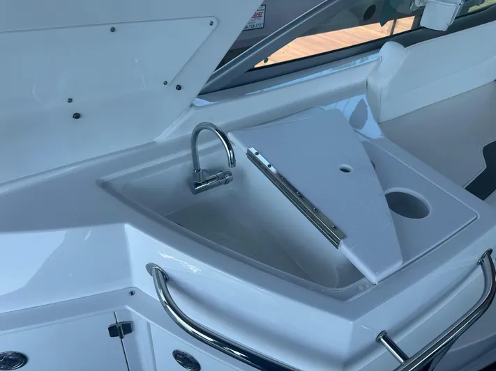 Always Flo&rsquo;n Yacht Photos Pics 2019 Monterey 295 Sport Yacht sink area with faucet and countertop.