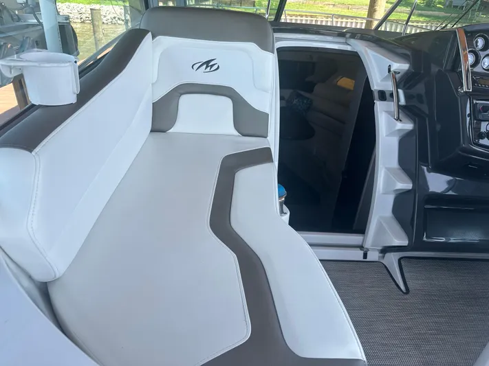 Always Flo&rsquo;n Yacht Photos Pics 2019 Monterey 295 Sport Yacht interior with white and gray seating and cabin entrance.