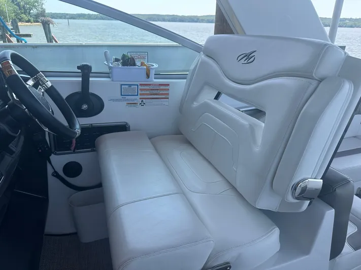Always Flo&rsquo;n Yacht Photos Pics 2019 Monterey 295 Sport Yacht interior with white leather seating and steering wheel.