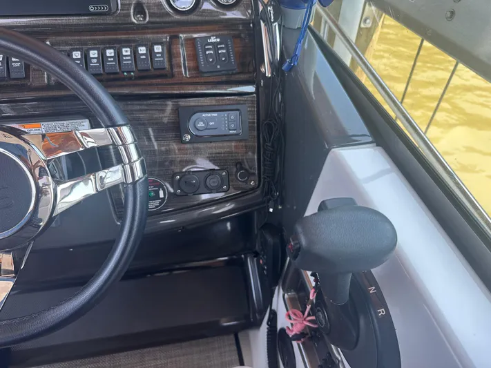 Always Flo&rsquo;n Yacht Photos Pics 2019 Monterey 295 Sport Yacht dashboard with steering wheel and control panel.