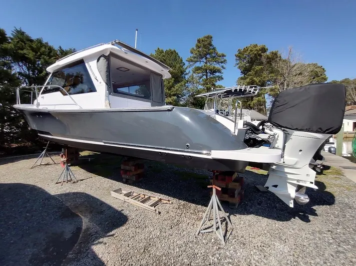 Singularity Yacht Photos Pics 2022 True North 34 boat on stands, gray hull, outdoor setting.
