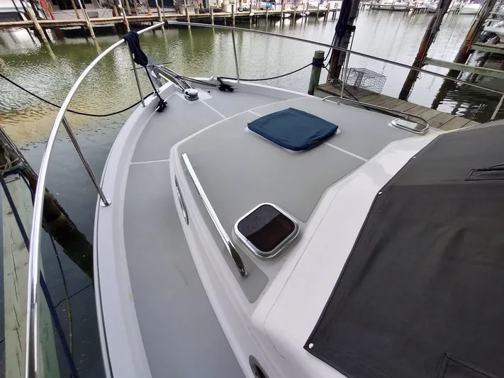 Singularity Yacht Photos Pics True North 34 boat deck, 2022 model, docked at marina with calm water.