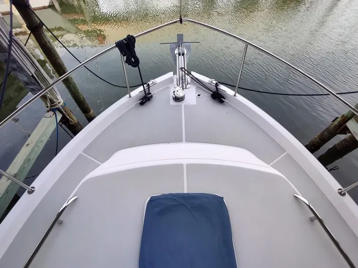 Singularity Yacht Photos Pics Bow view of 2022 True North 34 boat docked on calm water.