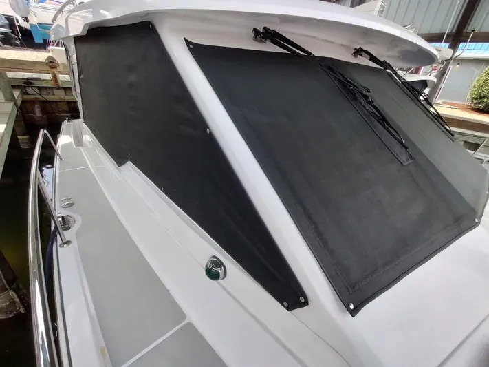 Singularity Yacht Photos Pics 2022 True North 34 boat with covered windows and sleek design.