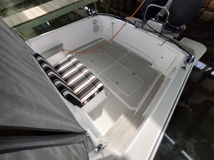 Singularity Yacht Photos Pics True North 34 boat interior, 2022 model, featuring striped seating and spacious deck area.