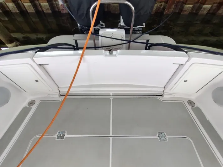 Singularity Yacht Photos Pics True North 34 boat deck, 2022 model, featuring storage compartments and an orange cable.