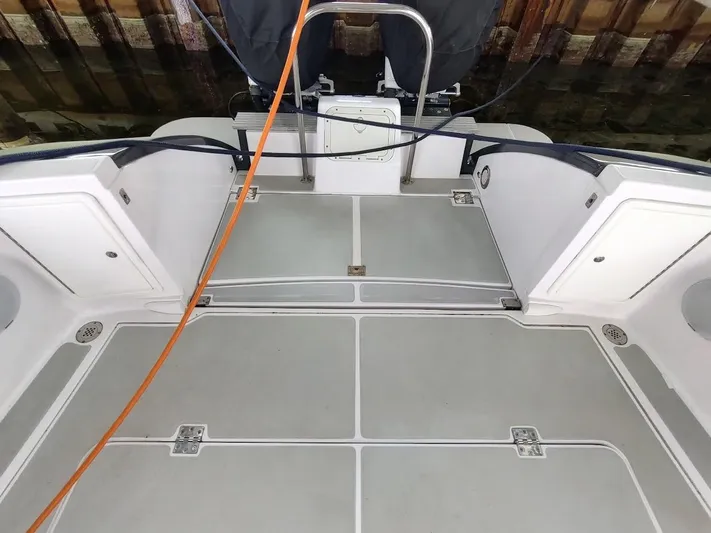 Singularity Yacht Photos Pics 2022 True North 34 boat deck with storage compartments and safety railing.