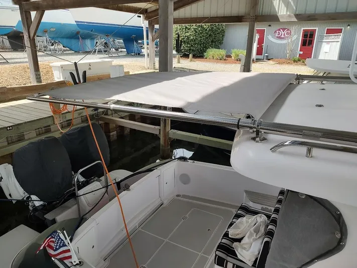 Singularity Yacht Photos Pics True North 34 boat with canopy, docked under shelter, 2022 model.