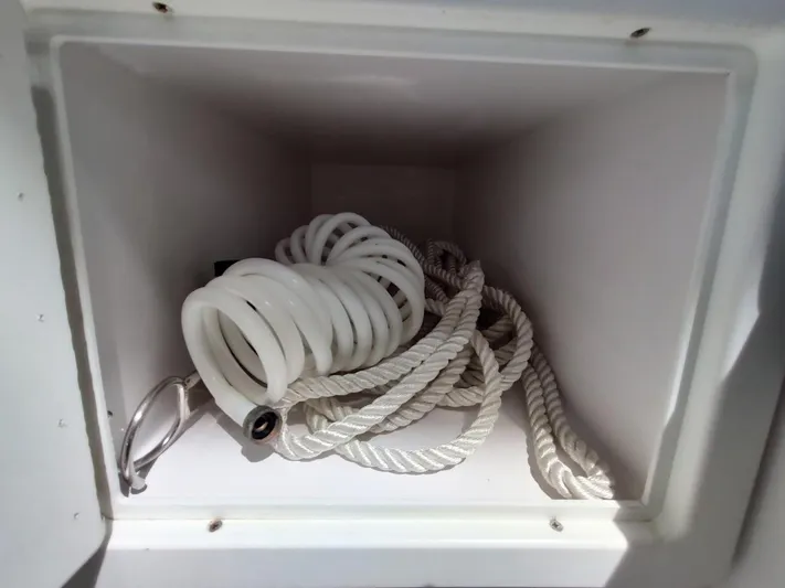 Singularity Yacht Photos Pics Coiled rope and hose inside a storage compartment of a 2022 True North 34 boat.
