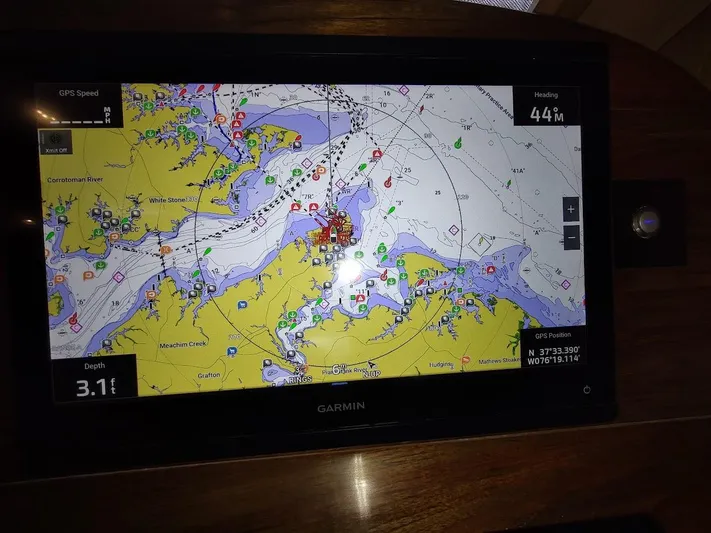 Singularity Yacht Photos Pics Garmin marine GPS display on True North 34, 2022 model, showing nautical chart and navigation data.