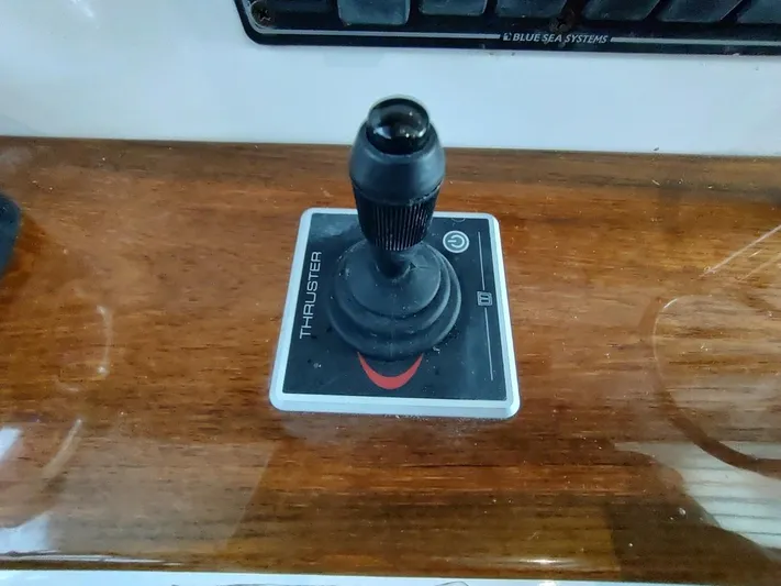 Singularity Yacht Photos Pics Joystick control for True North 34 boat thruster, 2022 model, on wooden panel.
