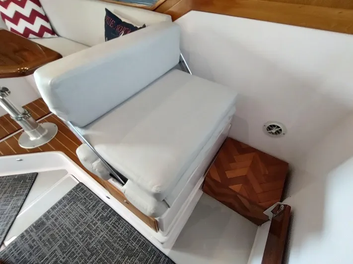Singularity Yacht Photos Pics Interior of 2022 True North 34 boat with white seating and wooden accents.