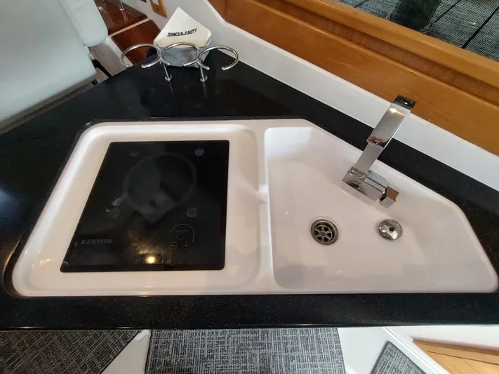 Singularity Yacht Photos Pics Modern kitchen sink and stove in 2022 True North 34 boat interior.
