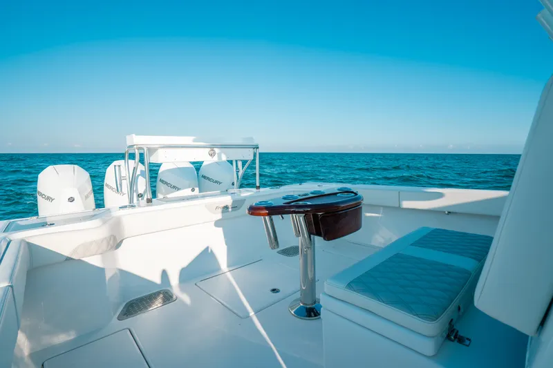  Yacht Photos Pics 2023 Front Runner 39 Center Console boat on open sea, featuring sleek seating and powerful engines.