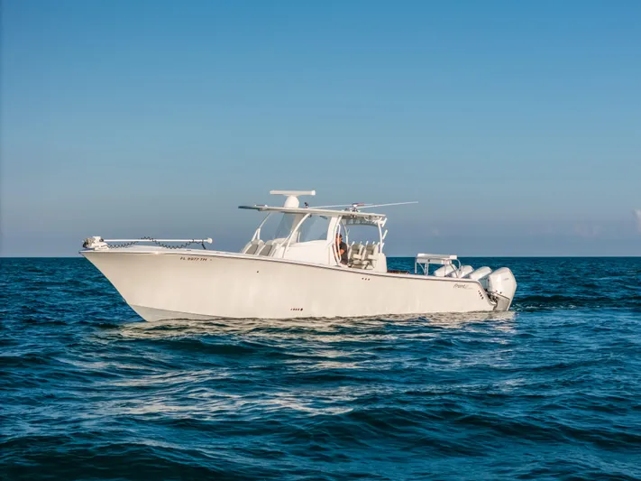  Yacht Photos Pics 2023 Front Runner 39 Center Console boat cruising on open water under clear blue sky.