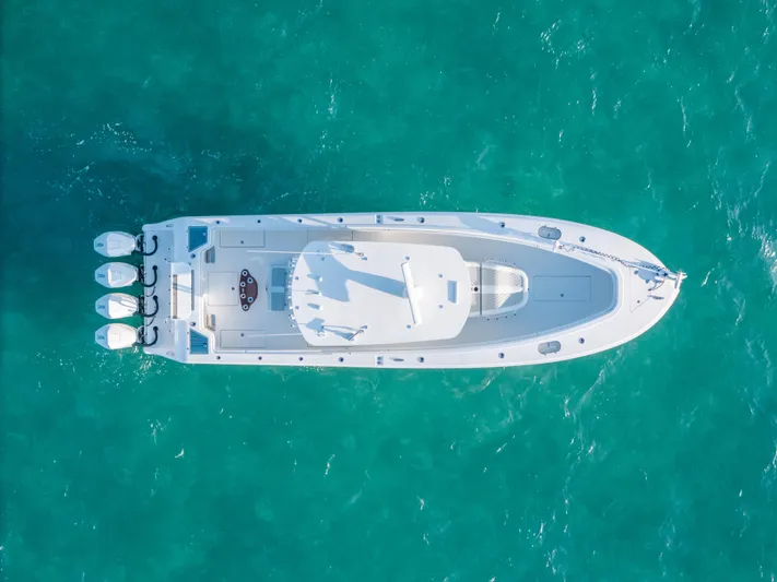  Yacht Photos Pics Aerial view of 2023 Front Runner 39 Center Console boat on turquoise water.