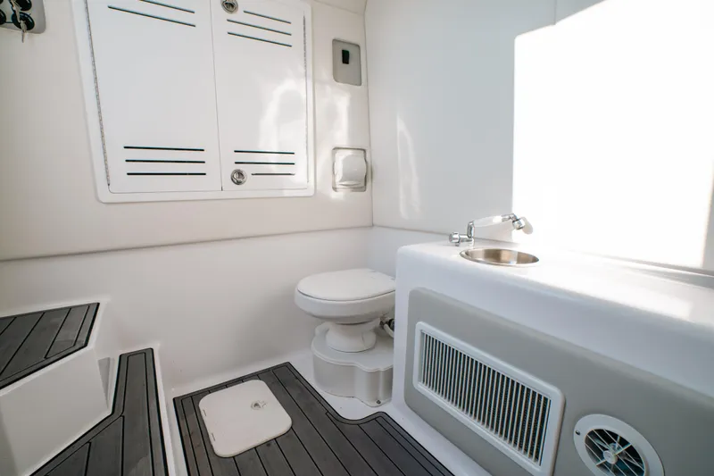  Yacht Photos Pics 2023 Front Runner 39 Center Console boat interior with toilet and sink.