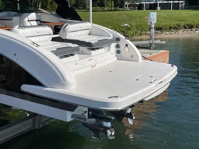  Yacht Photos Pics 2016 Regal 3200 Bowrider boat with spacious swim platform on calm water.