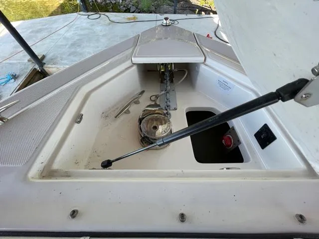  Yacht Photos Pics 2016 Regal 3200 Bowrider anchor compartment with hydraulic support and visible anchor chain.