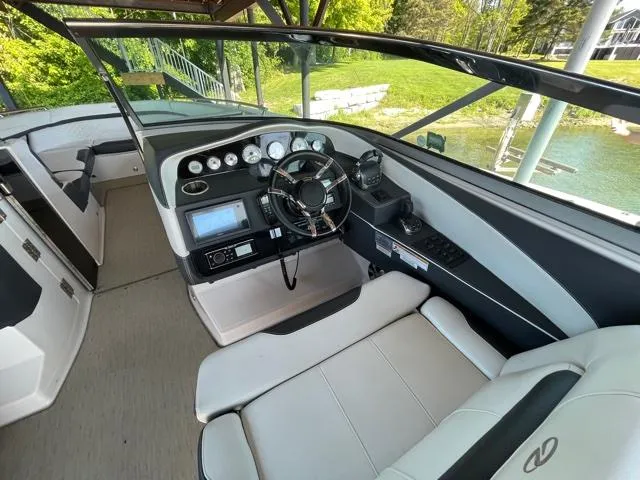  Yacht Photos Pics 2016 Regal 3200 Bowrider cockpit with modern controls and comfortable seating.