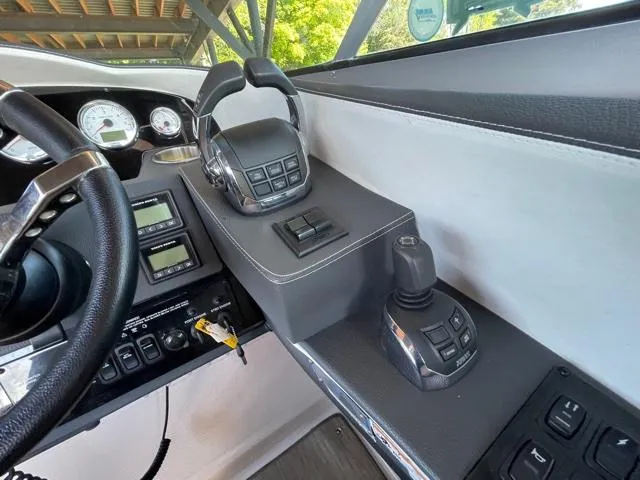  Yacht Photos Pics 2016 Regal 3200 Bowrider dashboard with controls and steering wheel.