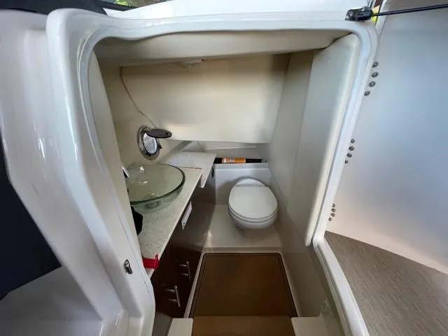  Yacht Photos Pics 2016 Regal 3200 Bowrider boat bathroom with modern fixtures and compact design.