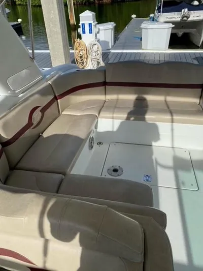  Yacht Photos Pics 2010 Formula 350 Sun Sport boat interior with beige seating at a marina.