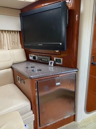  Yacht Photos Pics Interior of 2010 Formula 350 Sun Sport with TV, counter, and seating area.