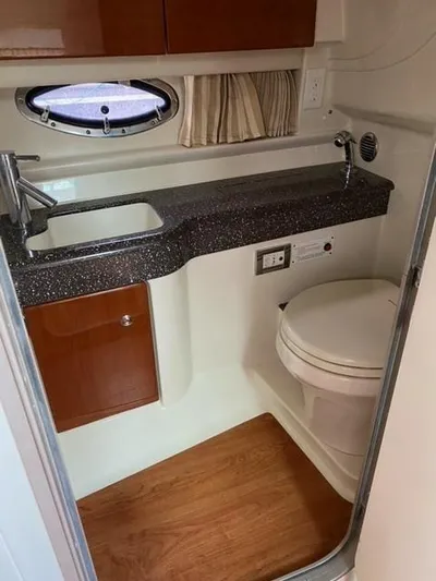  Yacht Photos Pics 2010 Formula 350 Sun Sport bathroom with sink, toilet, and wood flooring.
