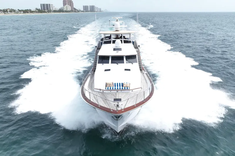 Captivator Yacht Photos Pics 1984 Palmer Johnson Motor Yacht cruising on open sea, aerial view.