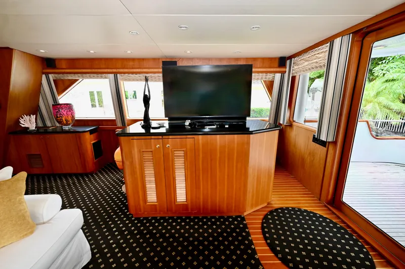 Captivator Yacht Photos Pics Luxurious 1984 Palmer Johnson motor yacht interior with elegant wood paneling and modern decor.