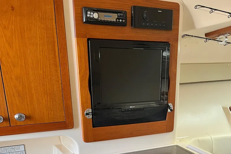  Yacht Photos Pics 2009 Grady-White Express 330 cabin with built-in TV and audio system.